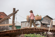 Bicycle acrossing bridge / Experiences when travelling through villages in Cambodia