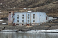Derelict building near the Pyramiden dock / Pyramiden, an abandoned Russian mining settlement
